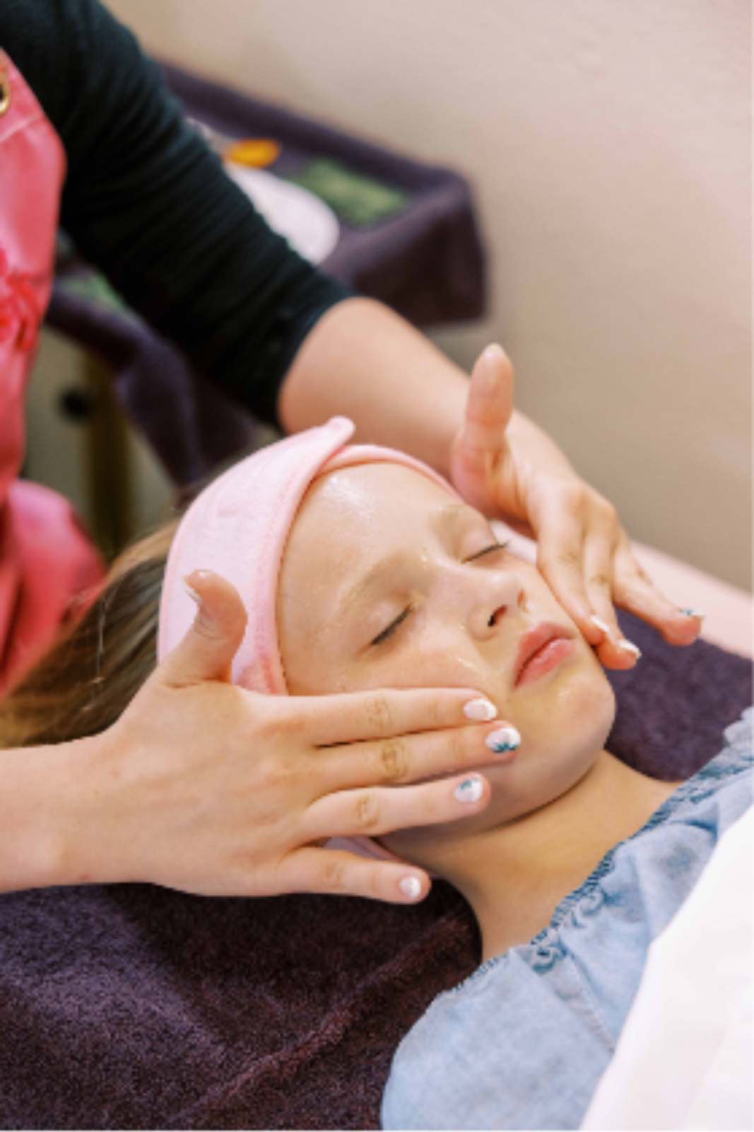 Close-up of a woman receiving a luxury facial treatment in a calm spa setting