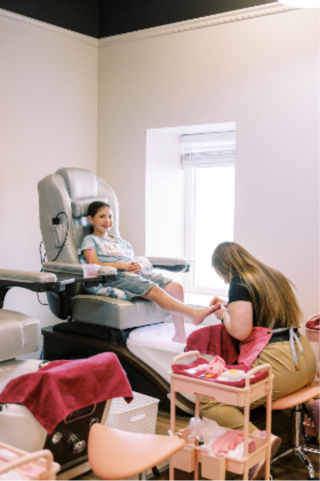 Mother and daughter enjoying a pedicure together during a relaxing spa visit
