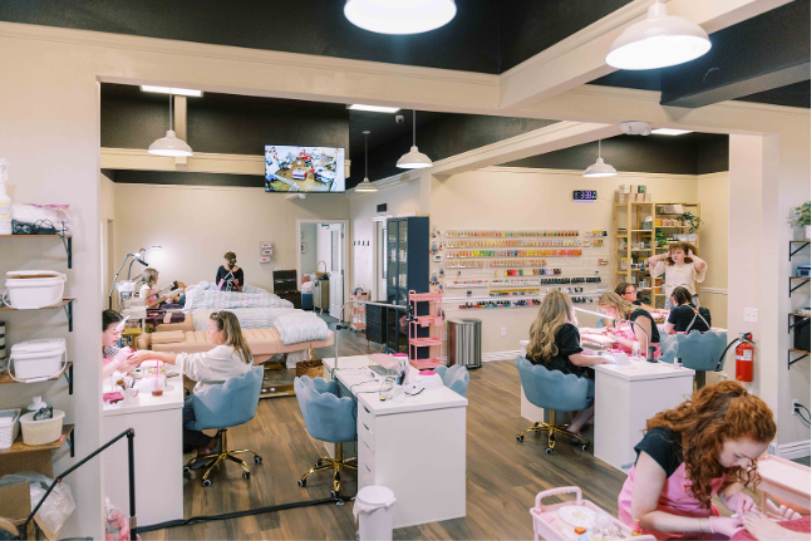 Mother and daughter getting a manicure together in a warm, welcoming spa setting