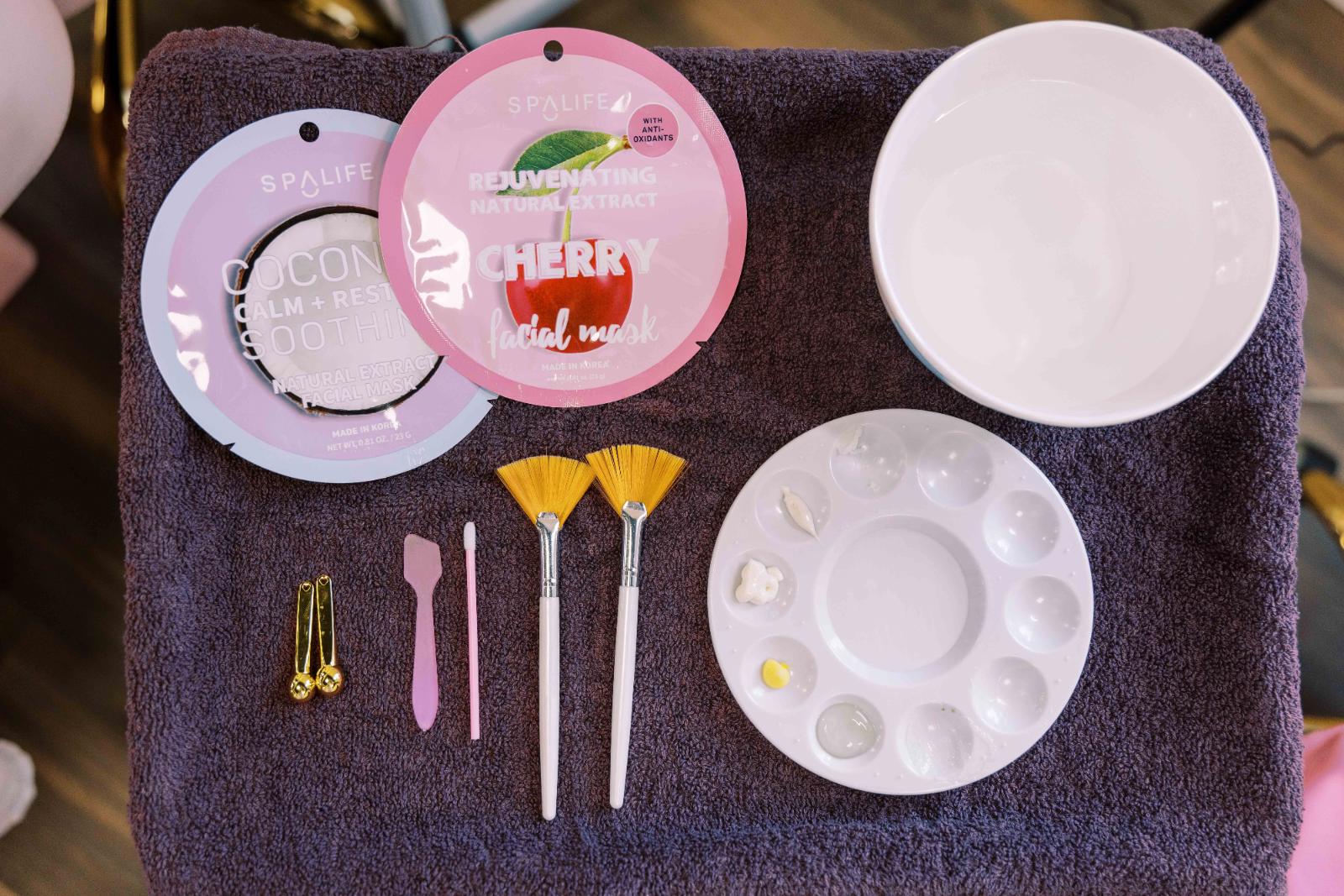 Facial massage tools, including gua sha, arranged for a professional spa facial treatment