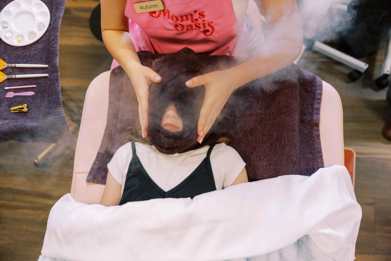 Woman enjoying a professional facial treatment in a luxury spa setting